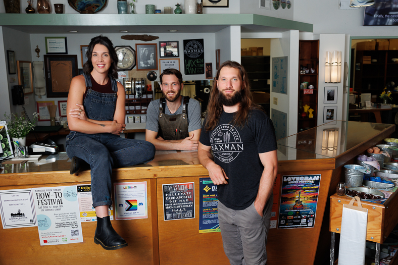 Bob's Three Adult Children Stand at the Waxman Showroom Counter.